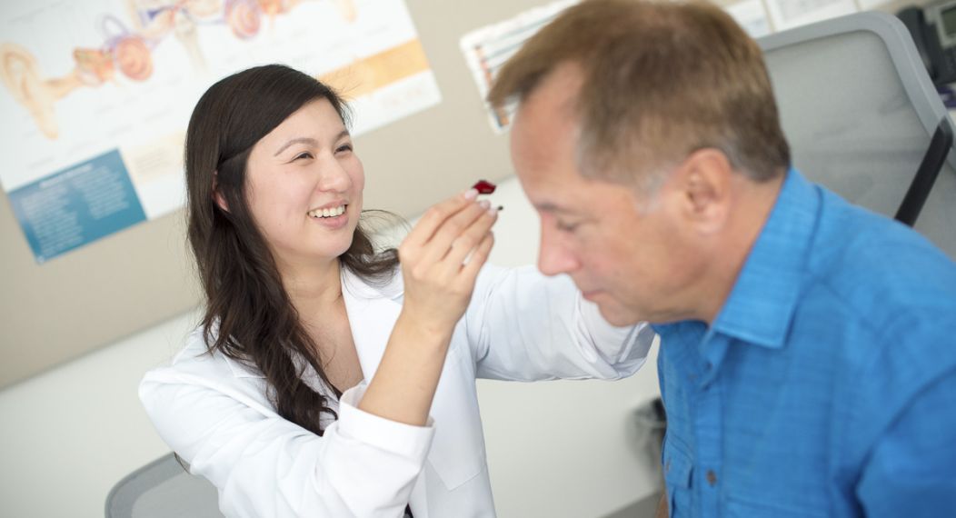Audiology student with patient